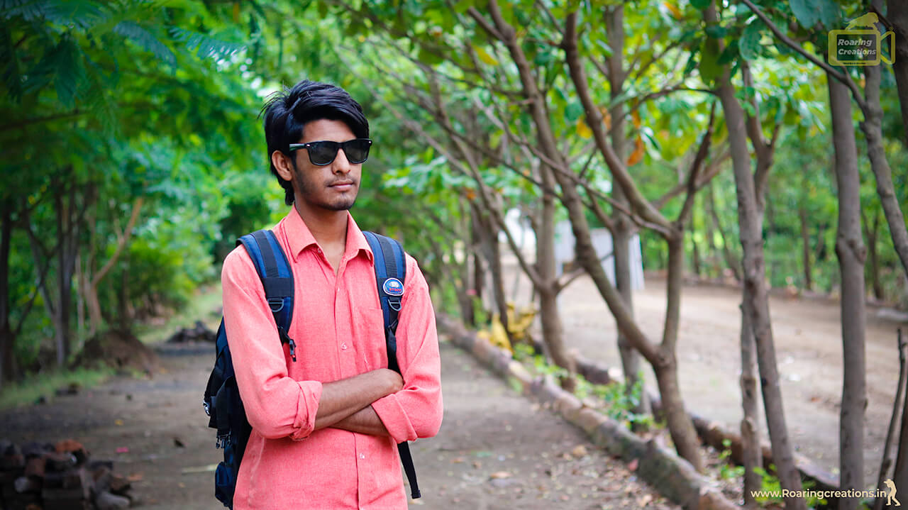 Young man focusing with photo camera and looking at camera · Free Stock  Photo